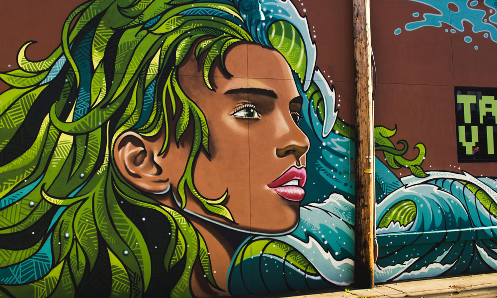 Graffiti art of an elfin figure with green hair